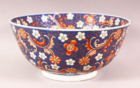 A CHINESE BLUE GROUND PORCELAIN BOWL, incised and painted with flower head design, mark to base,