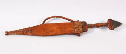 A 19TH / 20TH CENTURY NORTH AFRICAN DAGGER - With its bound leather sheath - 32cm