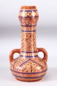 A HISPANO MOREQUE LUSTRE GLAZE TWIN HANDLE VASE, decorated with a copper and blue lustre depicting