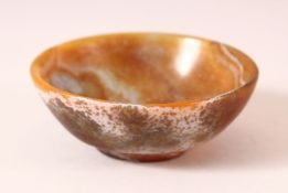 A CHINESE SMALL CARVED AGATE CIRCULAR BOWL, 9cm diameter.