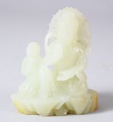 A CHINESE JADE CARVING OF A DEITY and attendant, 8cm high, base 7cm x 4cm.