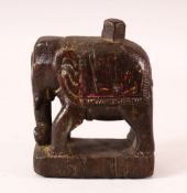 A 17TH CENTURY INDIAN CARVED WOOD FIGURE OF AN ELEPHANT, 14.5cm high.