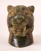 AN INDIAN CARVED JADE TIGER HEAD BUST, the tiger bearing its teeth, 11cm high.