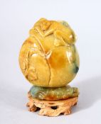 A GOOD CHINESE CARVED JADE MONKEY, PEACH & LOTUS SNUFF BOTTLE AND STAND - the upper part carved with