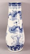 A LARGE CHINESE BLUE AND WHITE TAPERING VASE / STICK STAND, the body painted with dragons around the