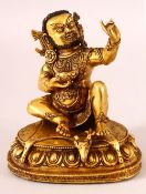 A CHINESE GILT BRONZE FIGURE OF A DEITY, in two parts, seated holding a bowl, 15cm high.