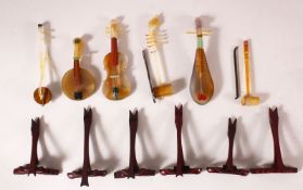 A GROUP OF SIX CHINESE MINIATURE HARD STONE MODELS OF MUSICAL INSTRUMENTS, complete with stands,