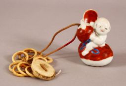A 19TH CENTURY JAPANESE MEIJI PERIOD PORCELAIN NETSUKE OF A BOY - the netsuke modeled as a boy