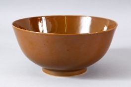 A CHINESE CAFE AU LAIT GLAZE PORCELAIN BOWL, the base six character mark in blue, 19.5cm diameter.