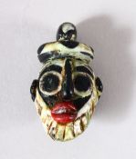 A SMALL SYRIAN GLASS PENDANT, in the form of a bearded male head, 4.5cm.