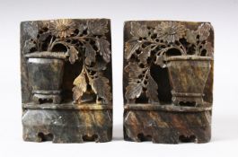 A PAIR OF CHINESE CARVED SOAPSTONE WALL HANGING PLAQUES - each carved in relief to depict displays