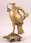 AN UNUSUAL INDIAN BRASS HUQQA BASE, in the form of a bird standing on a turtle, 28cm high.