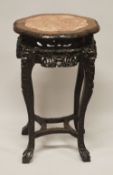 A 19TH CENTURY CHINESE CARVED HARDWOOD & MARBLE INSET STAND - the stand carved with fruit and