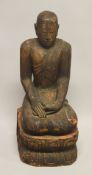 A LARGE AND HEAVY CARVED WOOD FIGURE OF BUDDHA, 79cm high.