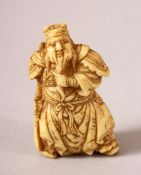 A JAPANESE MEIJI PERIOD CARVED IVORY NETSUKE OF A WARRIOR - the warrior stood in traditional