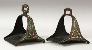 A MATCHED PAIR OF 18TH/19TH CENTURY PERSIAN OR OTTOMAN STEEL STIRRUPS, inset with turquoise beads.
