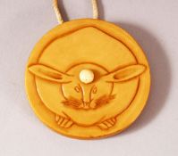 A JAPANESE MEIJI PERIOD CARVED IVORY KAGIMIBUTA NETSUKE OF A RABBIT / HARE - the netsuke carved with