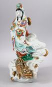 A JAPANESE MEIJI PERIOD KUTANI PORCELAIN FIGURE OF KWANNON & DRAGON - kwannon stood upon the back of