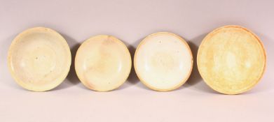 FOUR CHINESE TERRACOTTA BOWLS, varying sizes.
