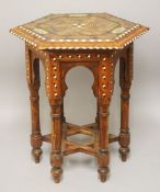 A 19TH CENTURY SPANISH INLAID OCTAGONAL WOODEN TABLE, the top inlaid with exotic timbers and ivory
