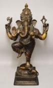 A LARGE AND HEAVY 18TH / 19TH CENTURY INDIAN BRONZE FIGURE OF GANESH - the multi arm deity stood