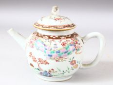 A CHINESE FAMILLE ROSE PORCELAIN TEAPOT AND COVER, painted with a cherry tree and a wall and temple,