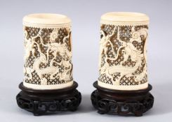 A PAIR OF 19TH CENTURY CHINESE CANTON CARVED IVORY OPENWORK VASES - each vase carved to depict