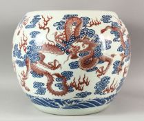 A VERY LARGE CHINESE DRAGON FISH BOWL, painted with iron red dragons and the flaming pearl of