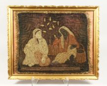 A TURKISH OTTOMAN TEXTILE, depicting two figures, framed and glazed, 46cm x 57cm.