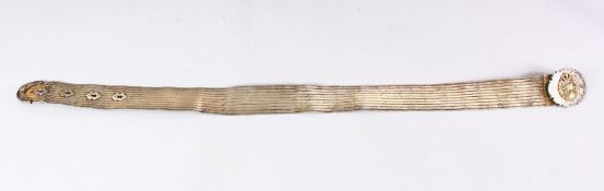 AN ISLAMIC SILVER OR WHITE METAL BELT, with emblem on the buckle, 85cm long.