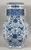 A CHINESE BLUE AND WHITE ZUN VASE, decorated with lotus flowers and floral motifs, 46cm high.