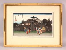 A JAPANESE WOODBLOCK PRINT, depicting figures aside mountains and temples, signed and sealed upper