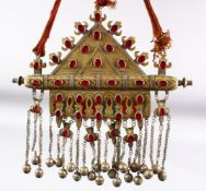 AN ISLAMIC CEREMONIAL NECKLACE with large metal pendant, the pendant 27cm x 21.5cm.