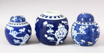 A LOT OF THREE CHINESE BLUE & WHITE PORCELAIN PRUNUS GINGER JARS, one with a cover -