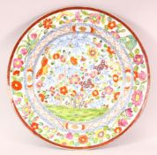 A GOOD 18TH/19TH CENTURY CHINESE PORCELAIN DISH, profusely painted with colourful flowers, 35cm