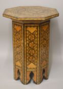 A 18TH/19TH CENTURY SYRIAN INLAID OCTAGONAL WOODEN TABLE, the top inlaid with exotic timbers and