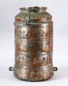 AN ISLAMIC TINNED COPPER FOUR TIER STORAGE VESSEL - engraved with stylized decoration, with a top