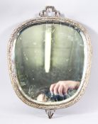 A CHINESE WHITE METAL CARVED WALL MIRROR - the mirror encapsulated with a white metal body, the