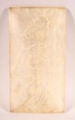 AN INDIAN CARVED / MOULDED GLASS PANEL OF A FIGURE, 18cm x 9.5cm.