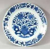 A CHINESE BLUE AND WHITE PORCELAIN DISH, decorated with flowers, 26.5cm diameter.