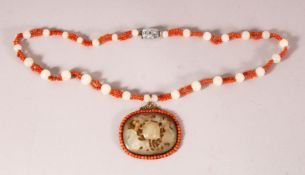 A CHINESE JADE AND CORAL PENDANT AND CHAIN, the pendant with pierced and carved decoration with