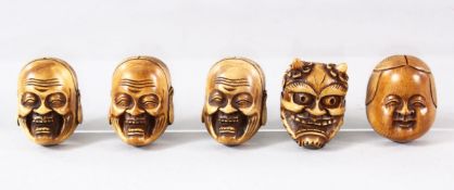 FIVE SMALL JAPANESE CARVED HANNYA / DARUMA MASKS, each approx. 3.5cm x 2.5cm.