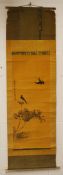 A CHINESE SCROLL PAINTING ON SILK of birds and lotus, signed and sealed, scroll with bone handles,
