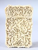 A GOOD CHINESE CANTON CARVED IVORY CARD CASE, carved with figures in a busy landscape, 10.5cm x 6.