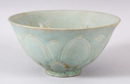 A CHINESE CELADON BOWL, POSSIBLY 19TH CENTURY, with moulded petal decoration, 14.5cm diameter.