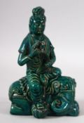A CHINESE SONG STYLE TURQUOISE GLAZED FIGURE OF GUYANYIN - seated upon her elephant - the