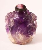 A CHINESE CARVED AMETHYST QUARTZ SNUFF BOTTLE, 5.5cm.