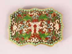 A CHINESE CLOISONNE ENAMEL BELT BUCKLE - decorated in raised apple green enamel depicting lotus,