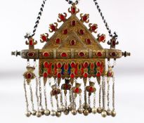 AN ISLAMIC CEREMONIAL NECKLACE with large metal pendant, the pendant 32.5cm x 22cm.