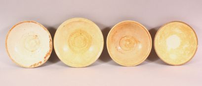 FOUR CHINESE TERRACOTTA BOWLS, varying sizes.